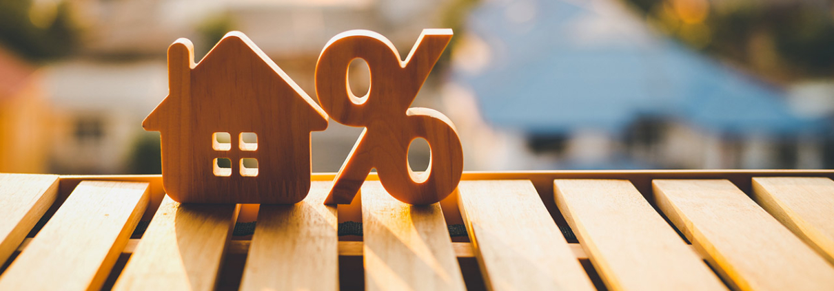 Percentage and house sign symbol icon wooden on wood table