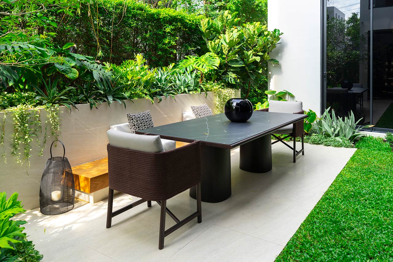 Backyard outdoor patio with modern dining table