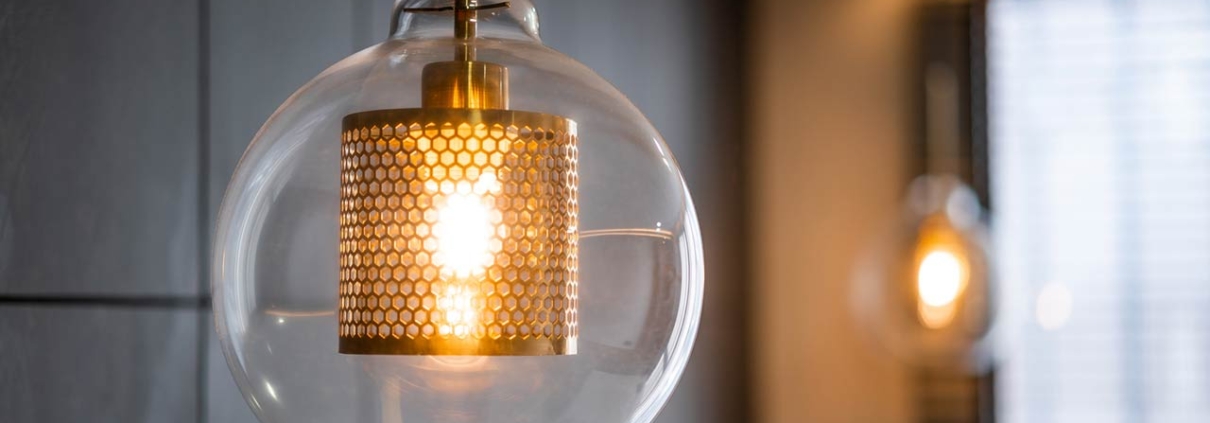 Vintage luxury interior lighting with bronze plate and transparent glass bulb