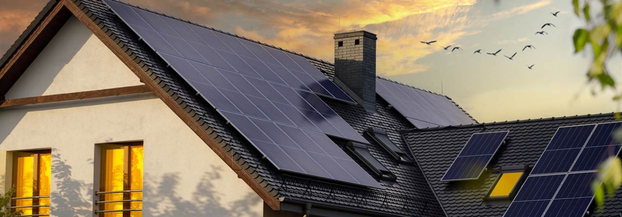 Night view of a beautiful white house with solar panels