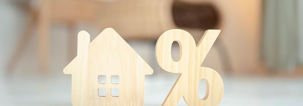Percentage and house sign symbol icon wooden on wood table