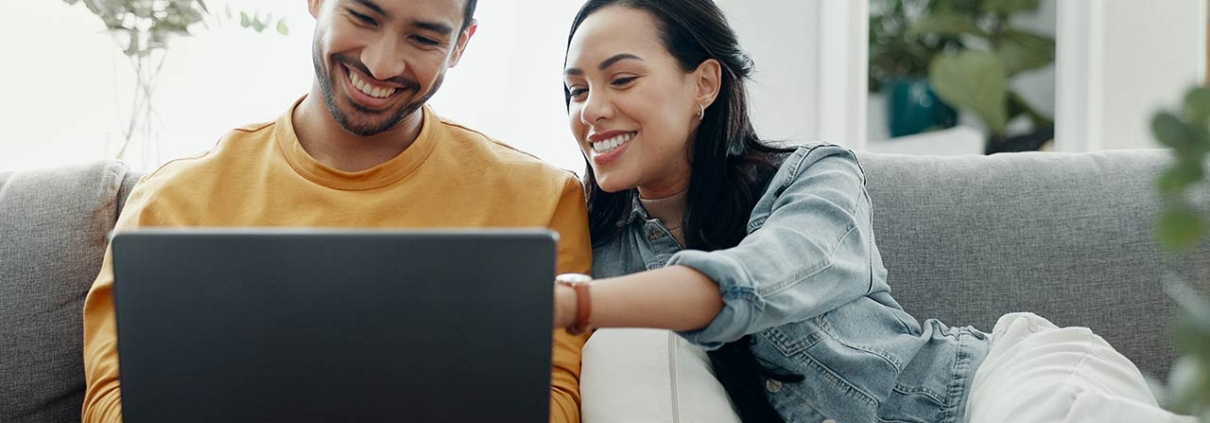 Home laptop, smile and relax couple search internet