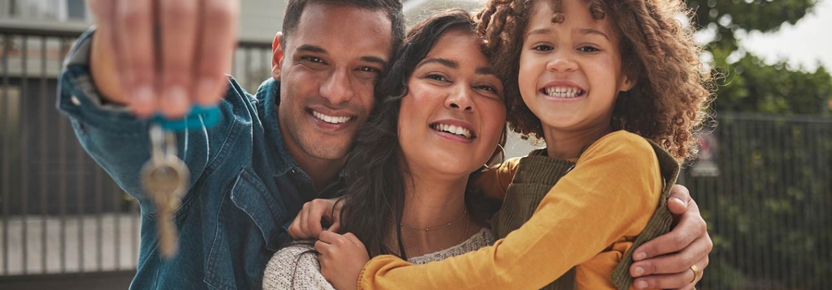 Happy family, portrait and real estate with keys in property, investment or new home together