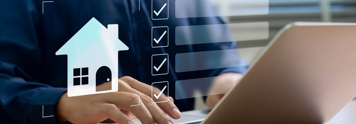 A professional organizing real estate tasks on a laptop using a digital checklist