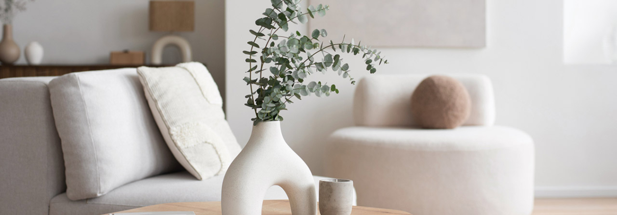 Chair with pillow, coffee table, vase in a living room stock photo