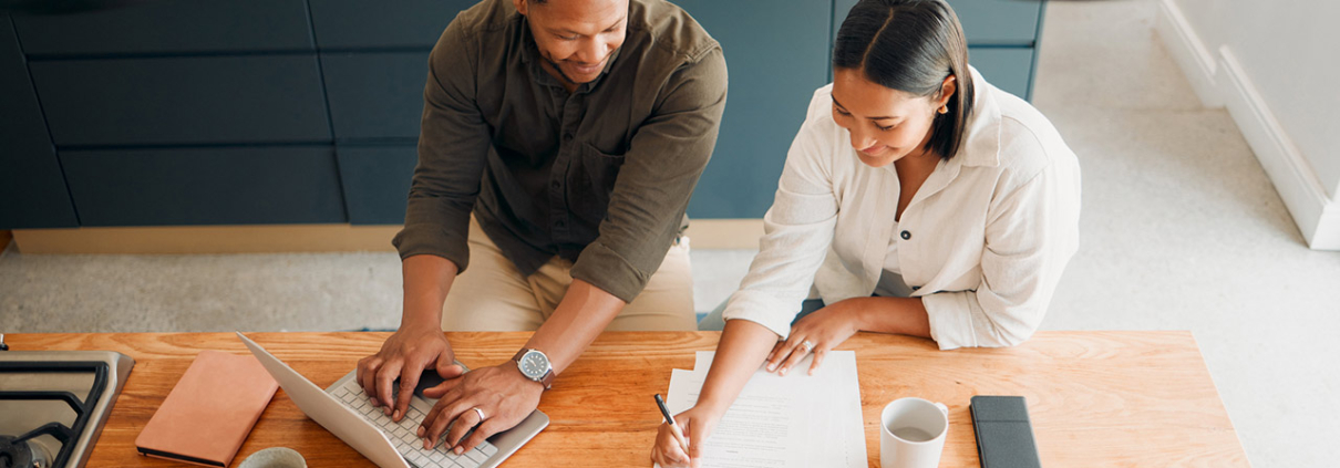 Couple calculating budget, finance and tax while planning investment, loan and bills at home from above