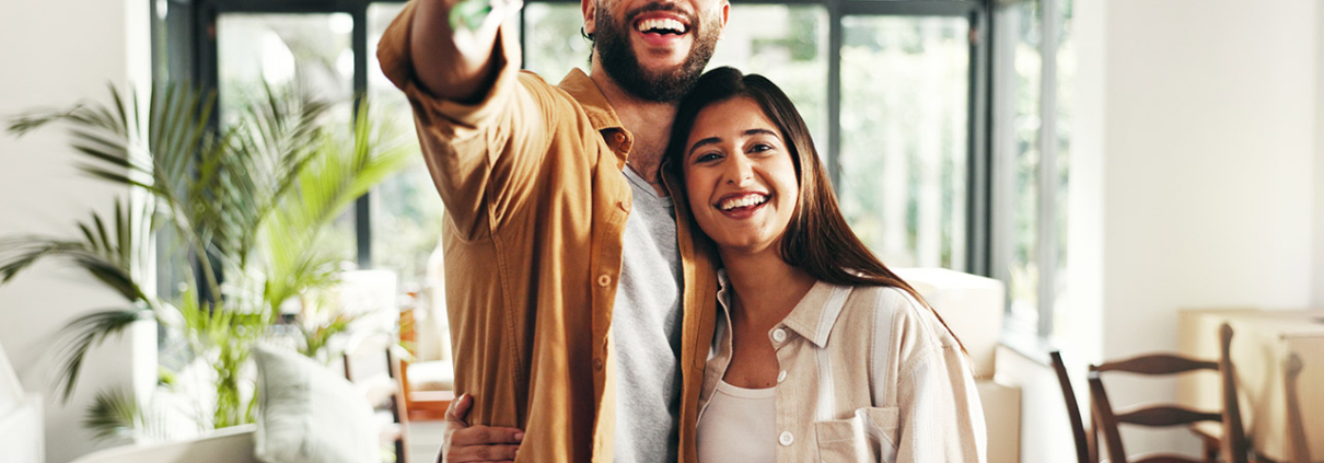 happy home buyers in new home stock photo