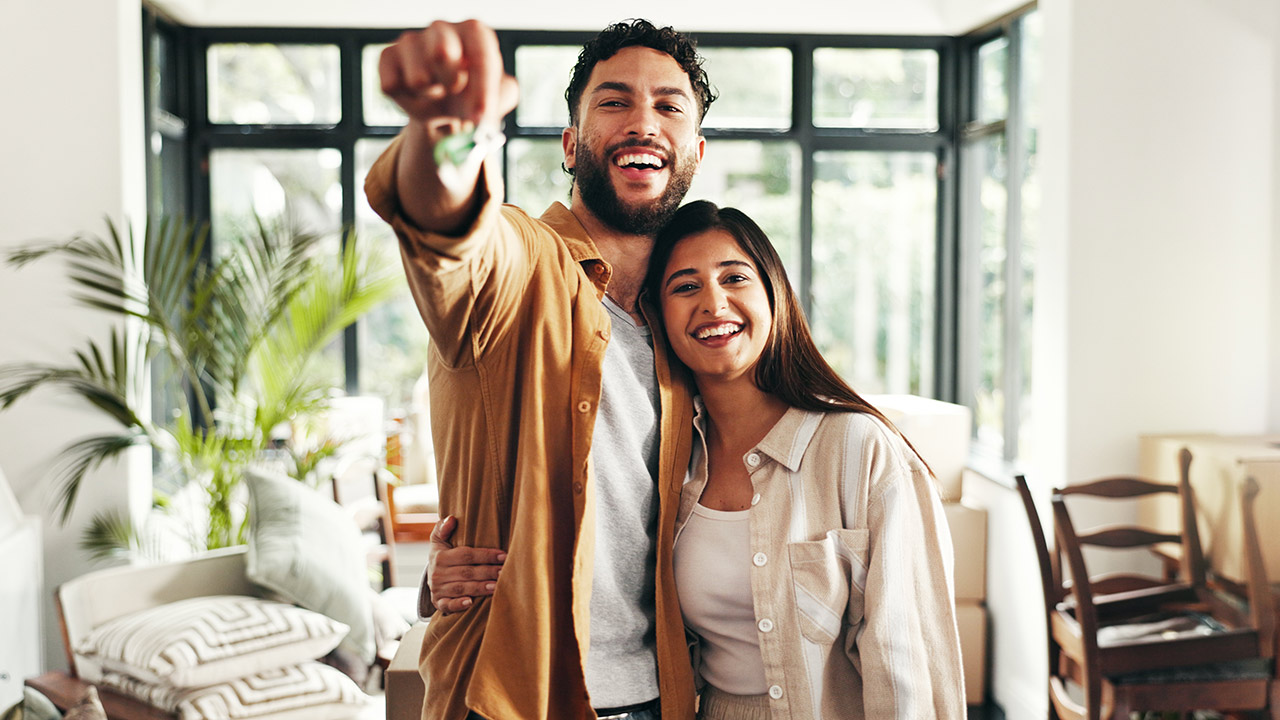 happy home buyers in new home stock photo
